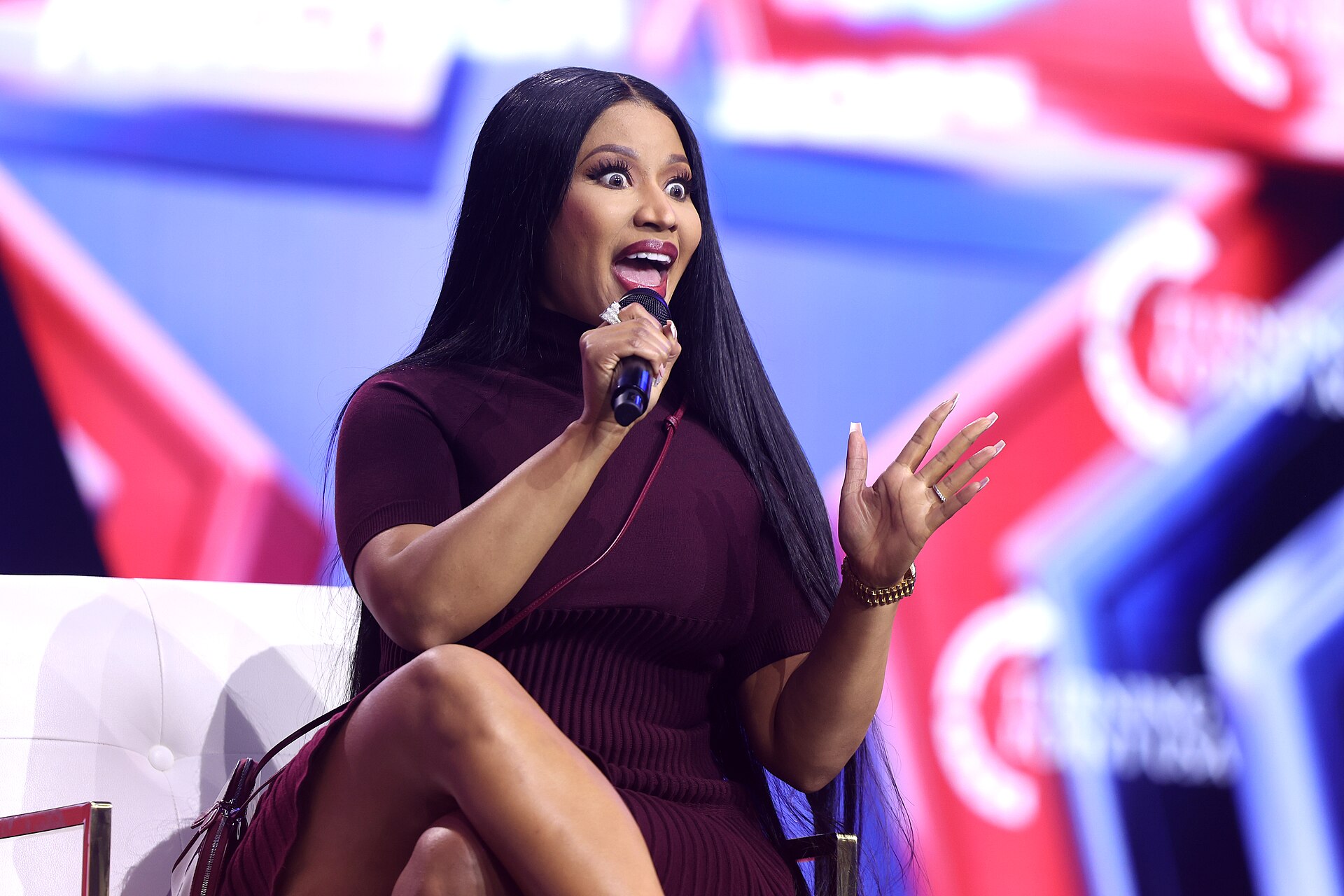 Nicki Minaj speaking with attendees at AmericaFest 2025 in Phoenix.
